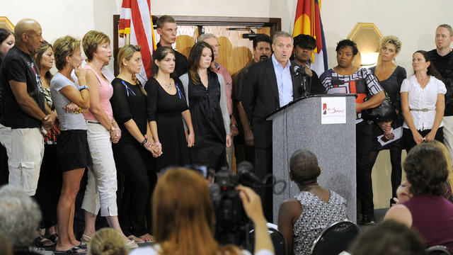 Tom Teves, at podium, group spokesman of the families of the victims of the Colorado theatre shooting, speaks during a press conference in Aurora, Colo., on Tuesday, Aug. 28, 2012.  
