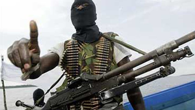 A militant patrols the creeks of the Niger Delta 
