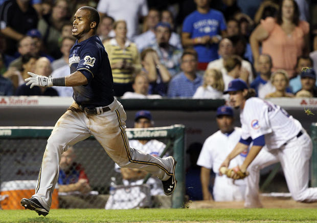 Jean Segura runs to home after Luis Valbuena missed the catch 