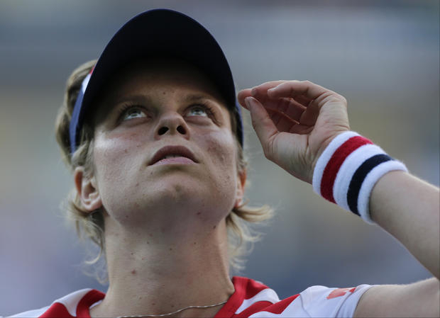 Kim Clijsters of Belgium looks up after losing to Laura Robson 