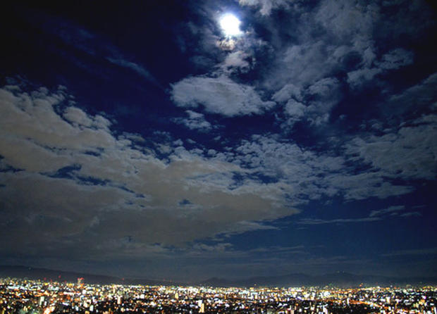 Night sky watcher Angela Saeki caught the blue moon from her balcony on the 34th floor in Osaka, Japan, August 30, 2012. 