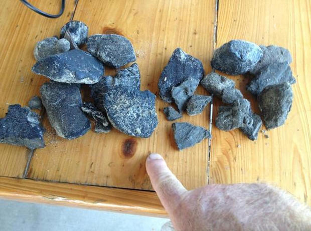 Tar balls that were discovered in the Grand Isle area by a local fisherman.  The Louisiana Department of Wildlife and Fisheries has closed off a section of the coast to fishing due to tar balls and a tar mat. 