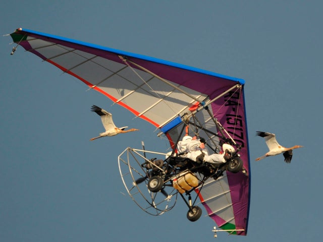 Russian President Vladimir Putin flies in a motorized hang glider 