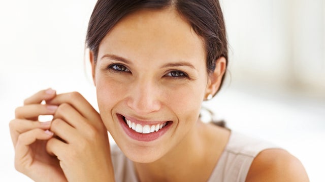 Gorgeous young female smiling confidently 