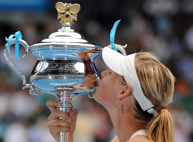 Maria Sharapova kisses the winners trophy 