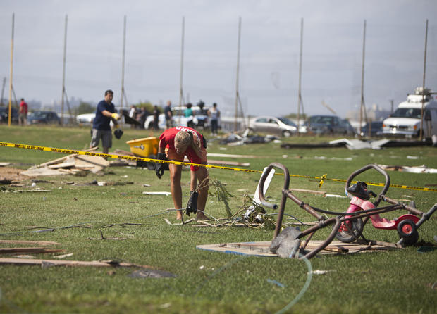 Lifeguards and maintenance crew clean up debris from a tornado that touched down on September 8, 2012 in the Breezy Point neighborhood of the Queens borough of New York City.  