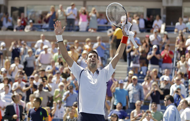 Novak Djokovic of Serbia reacts after beating Spain's David Ferrer 