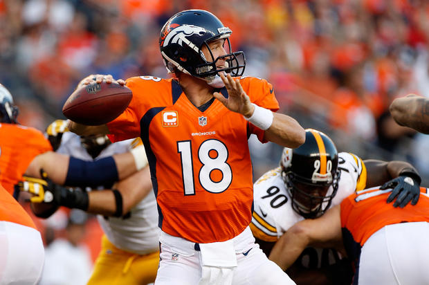 Peyton Manning delivers a pass 