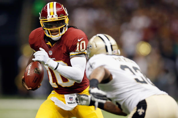 Robert Griffin III tries to avoid a tackle 