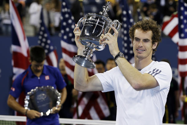 Andy Murray poses with the trophy 