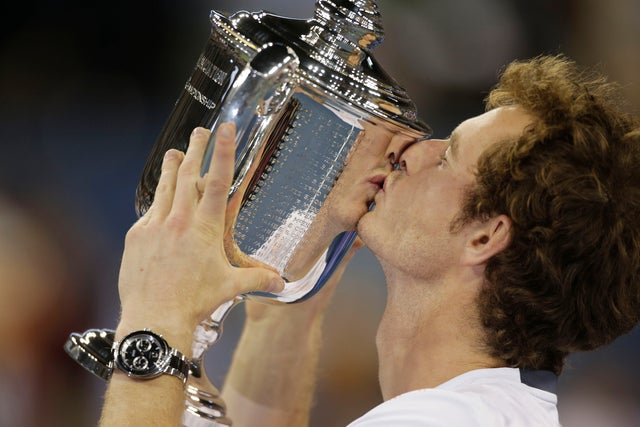 Andy Murray poses with the trophy after beating Novak Djokovic 