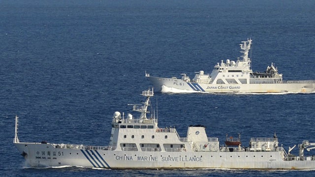  Sept. 2, 2012 file photo, the survey ship Koyo Maru, left, chartered by Tokyo city officials, sails around Minamikojima, foreground, Kitakojima, middle right, and Uotsuri, background, the tiny islands in the East China Sea, called Senkaku in Japanese and 