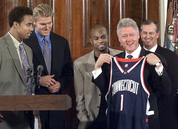 US President Bill Clinton receives a team jersey 