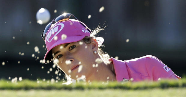 Paula Creamer watches her shot out of the sand 