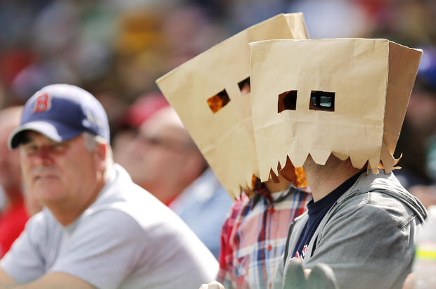Red Sox fans wear paper bags on their heads 