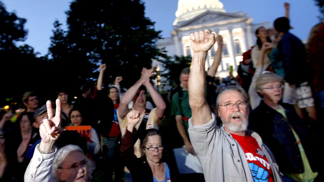 Supporters of a recall effort against Wisconsin Governor Scott Walker sing a union solidarity song outside the State Capitol Building as the poll numbers came in on Tuesday, June 5, 2012. 