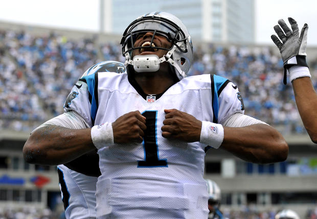 Cam Newton reacts after running for a touchdown 