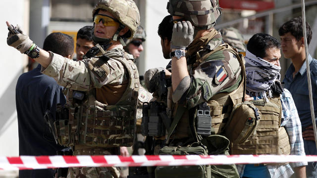 French soldiers arrive at the scene of a suicide bombing Sept. 18, 2012, in Kabul, Afghanistan. 