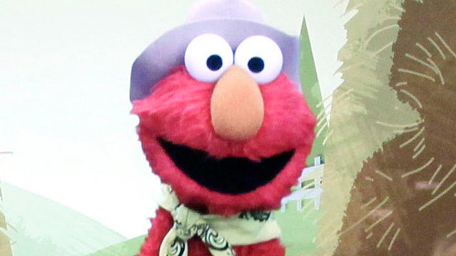 In this Sept. 5, 2012, photo, from left, Zoe Shyba, 3, and Aidan Lain, 7, play "Kinect Sesame Street TV" at the Sesame Street Workshop in New York. "Kinect Sesame Street TV", launching Tuesday, Sept. 18, 2012, uses Kinect, a motion and voice-sensing contr 