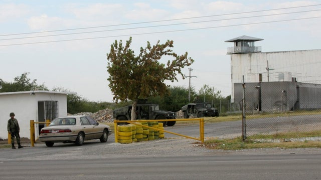 Mexican soldiers guard entrance to prison in Piedras Negras Tuesday 