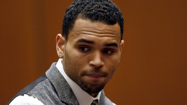 R&B singer Chris Brown appears in a Los Angeles courtroom Monday, Sept. 24, 2012. Judge Patricia Schnegg has ordered a further review of Chris Brown's community service and travel to determine whether Brown has violated the terms of his probation for the  