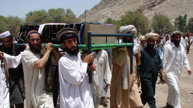 Pakistani tribesmen carry the coffin of a person allegedly killed in a U.S. drone strike 