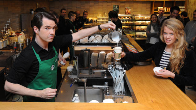 A barista serves a guest at a Starbucks store on March 14, 2012. 