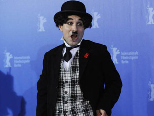 A man dressed up as Charlie Chaplin's ic 