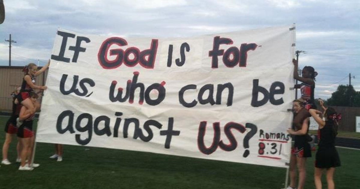 Texas cheerleaders get Bible verse flags back for now CBS News
