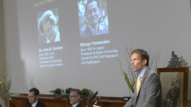 Thomas Perlmann of Karolinska Institute presents Sir John B. Gurdon of Britain and Shinya Yamanaka of Japan as winners of the 2012 Nobel Prize in medicine 