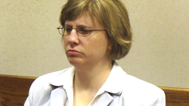 Kelly M. Rindfleisch sits in a Milwaukee County courtroom on Tuesday, March 20, 2012, awaiting her arraignment on charges that she conducted campaign work on county time. 