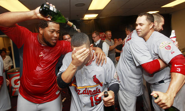St. Louis Cardinals' Victor Marte, Jon Jay, Chris Carpenter and Carlos Beltran celebrate in the locker room 