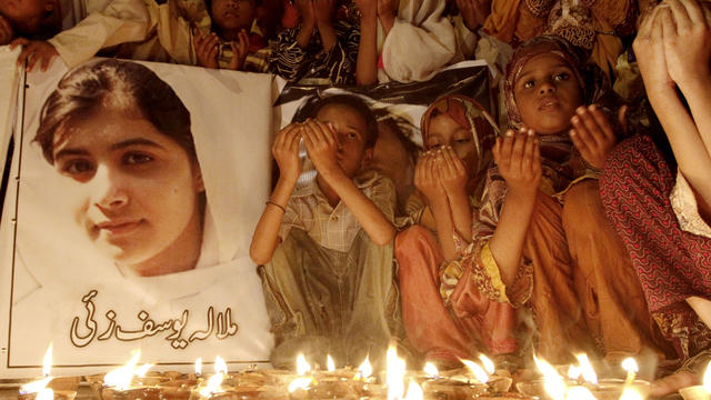 Pakistani children pray for the recovery of 14-year-old schoolgirl Malala Yousufzai, who was shot on Tuesday by the Taliban for speaking out in support of education for women, during a candlelight vigil in Karachi, Pakistan, Friday, Oct. 12, 2012. 