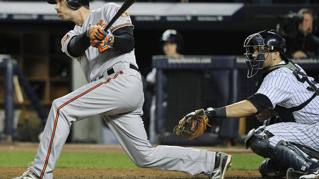 Baltimore Orioles' J.J. Hardy follows through on an RBI double during the 13th inning of Game 4 of the American League division baseball series against the New York Yankees on Thursday Oct. 11, 2012, in New York. The Orioles won 2-1. 