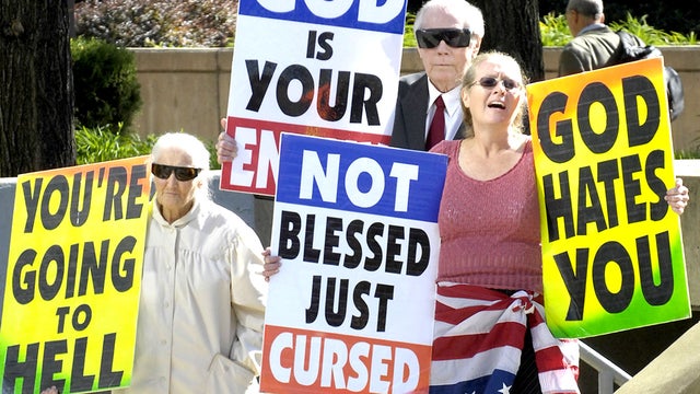 Margie M. Phelps, left, stands with her husband Pastor Fred Phelps and her daughter Margie J. Phelps during a demonstration outside the federal courthouse in Baltimore, Maryland, Wednesday, Oct. 31, 2007. 