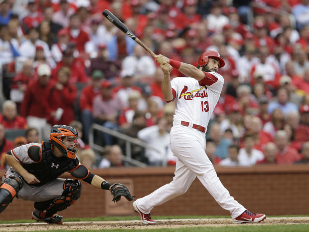 St. Louis Cardinals' Matt Carpenter (13) watches the ball as he hits a two-run home run during the third inning of Game 3 of baseball's National League championship series against the San Francisco Giants, Wednesday, Oct. 17, 2012, in St. Louis. 
