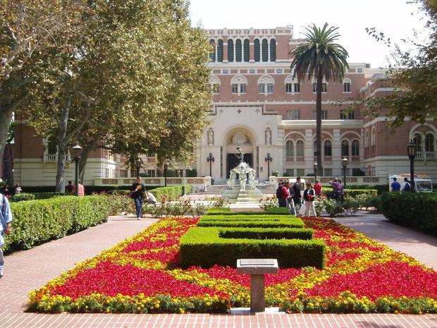Students walk outside Doheny Library at the University of Southern California. 