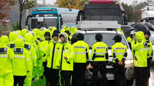 Police officers block vehicle containing anti-North Korea leaflets on road in Paju, near demilitarized zone, South Korea, Monday 