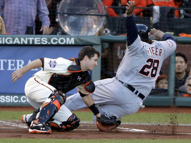 San Francisco Giants' Buster Posey tags out Detroit Tigers' Prince Fielder, right, at home plate in the second inning of Game 2 of the World Series Oct. 25, 2012, in San Francisco. 