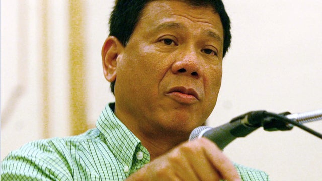 Mayor Rodrigo Duterte of the city of Davao, gestures as he addresses the peace and order council meeting he convened Thursday March 6, 2003. 