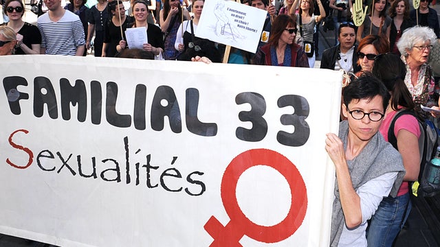 A woman holds a banner during a demonstration organized by the 'Droits des Femmes' association to claim for the right of abortion on March 24, 2012 in Bordeaux, southwestern France.  