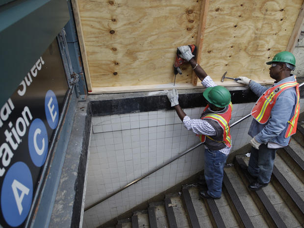 MTA workers prep a subway entrance in NYC 