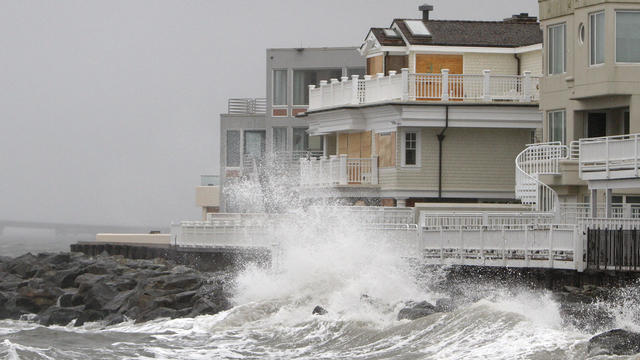 Waves crash onto the sea wall protecting homes in Longport, N.J., Oct. 28, 2012, as Hurricane Sandy approaches the area.  