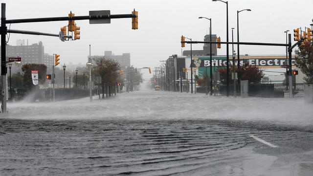 Wind blows across a flooded street as Hurricane Sandy moves up the coast in Atlantic City, New Jersey 