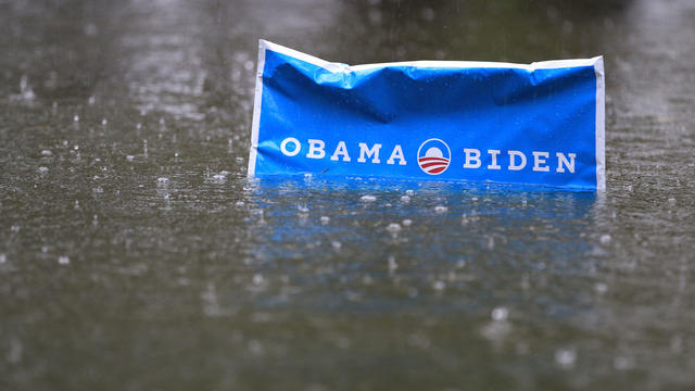 Hurricane Sandy: An Obama campaign sign rises above the floodwaters 