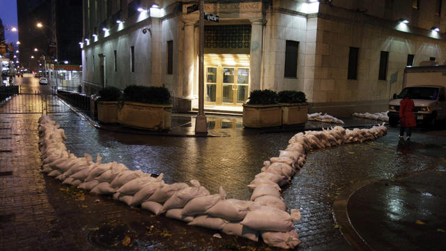 The closed New York Stock Exchange is barricaded with sand bags during the arrival of Hurricane Sandy on October 29, 2012. 
