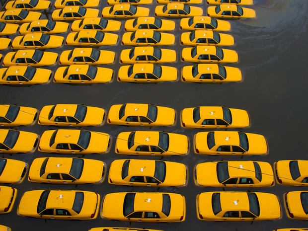 A parking lot full of yellow cabs is flooded as a result of superstorm Sandy 