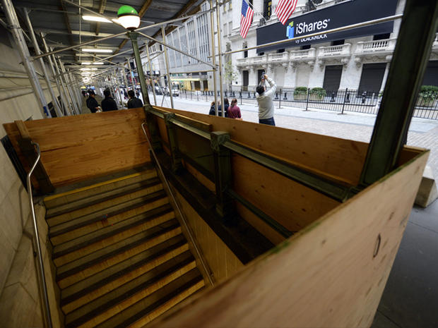 A subway station across the street from the New York Stock Exchange appears boarded up on October 28, 2012, a day before Hurricane Sandy made landfall in the U.S. The storm, which weakened from a hurricane to a post tropical storm hours before it reached  