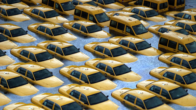 Taxis sit in a flooded lot after the superstorm Sandy Oct. 30, 2012, in Hoboken, N.J. 