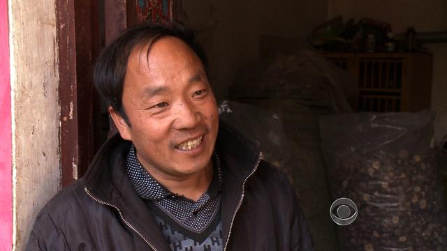 Jin Dengshan, a farmer, is one of some 128 million Chinese who live on less than $1.25 a day. 